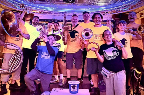 the band neon brass with their instruments